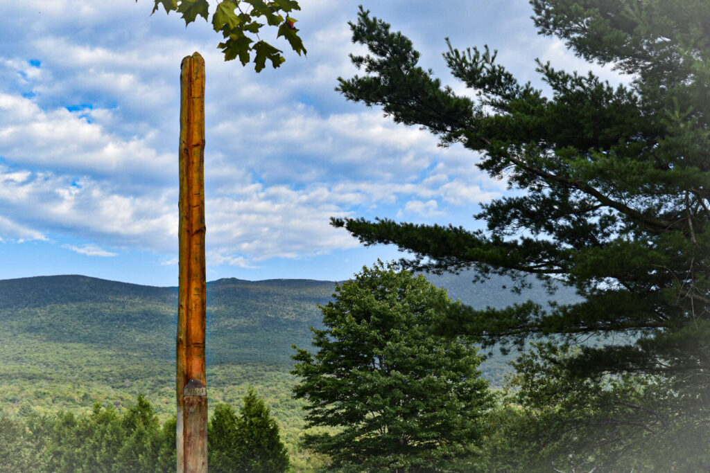 back of Clan Pole, mountains in background